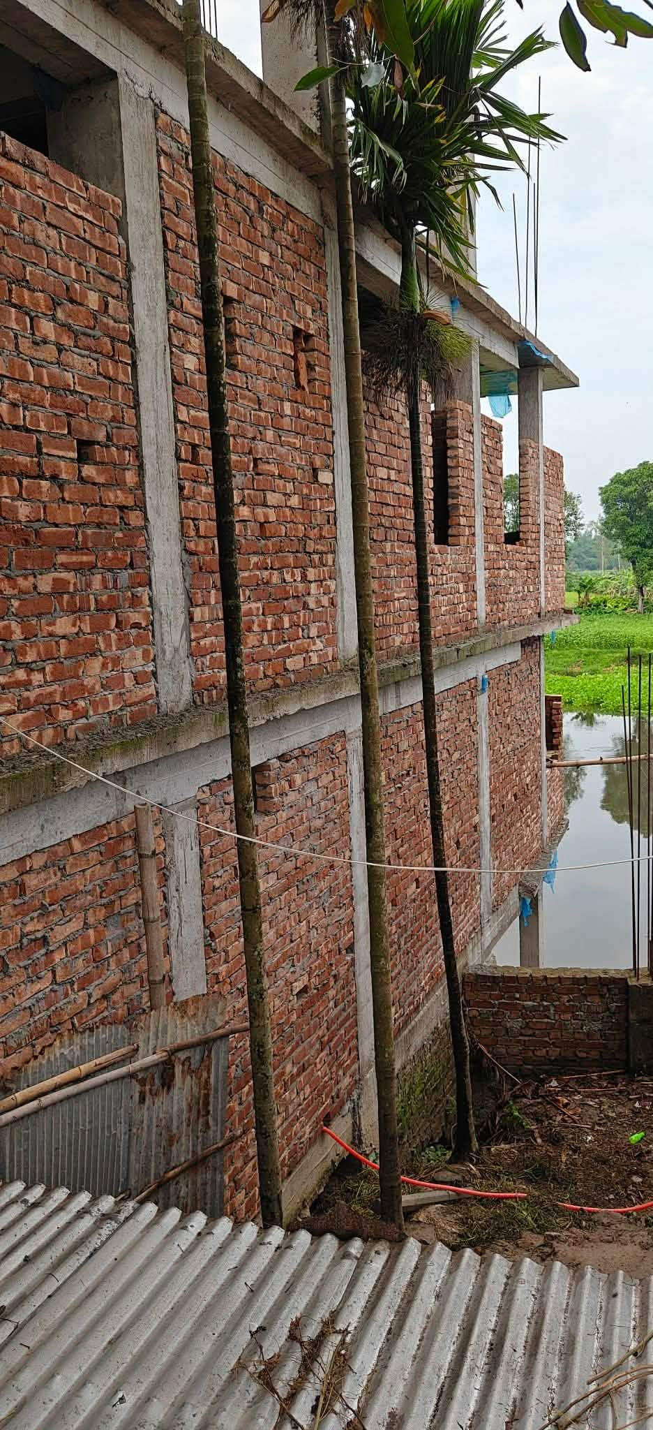 করতোয়া নদী দখল করে ভবন নির্মাণের অভিযোগ শিক্ষকের বিরুদ্ধে
